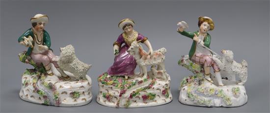 Two Staffordshire porcelain groups of a boy and a poodle and the companion group of a girl feeding a goat, c.1840-50,